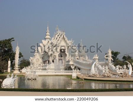 Wat Rong Khun or White Temple, a contemporary unconventional Buddhist temple in Chiangrai, Thailand, was designed by Arjan Chalermchai Kositpipat