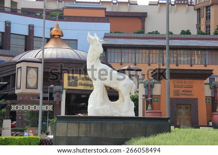 Macau - May 31, 2013: Beautiful Goat Statue, the symbol of fair play, is placed near famous casino resorts in Macau.