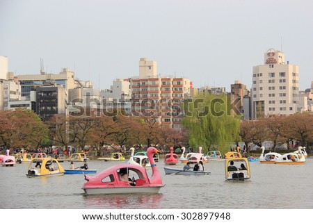Tokyo, Japan - April 12, 2015: People are having a good time with nautical activities at Boat Pond, one of 3 sections of Shinobazu Pond in Ueno Park, Tokyo, Japan.