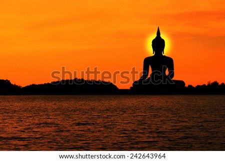silhouette of buddha and sunset