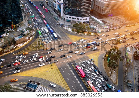 Traffic speeds through an intersection in Gangnam.Gangnam is an affluent district of Seoul. South Korea.