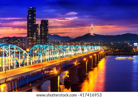 View of downtown cityscape at Dongjak Bridge and Seoul tower over Han river in Seoul, South Korea.