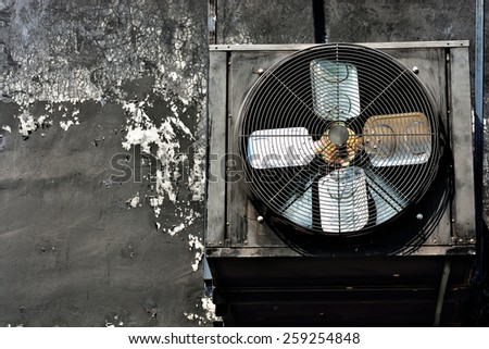 Vane air conditioning vents , black on black, dirty walls . The image darker .