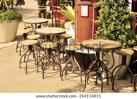 High chairs and tables grunge wooden and steel. Beside the restaurant themed swag