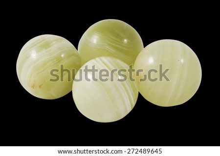 greenish onyx balls isolated on black