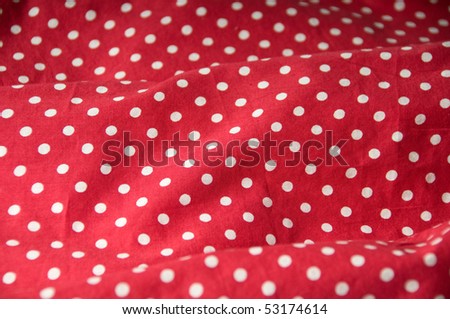 Red textile with white dots