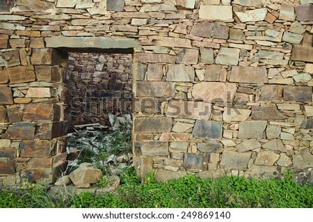 Old schist home facade wall. Background and texture