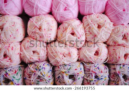 Store stock with balls of pink knitting wool. Hobbies and crafts