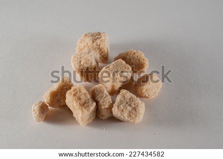pieces cane sugar on white background