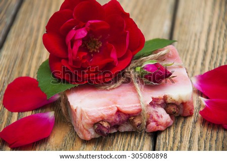 Rose handmade soap with flowers roses on a wooden background