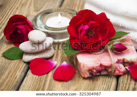 Rose handmade soap with flowers roses on a wooden background
