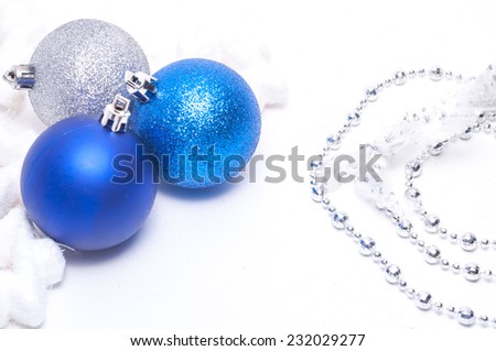 Blue and silver xmas balls and decoration with copy space on white background