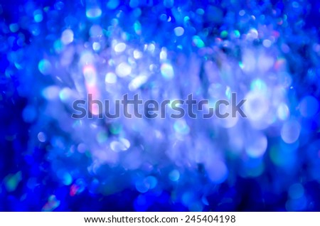 Abstract background with blue  bokeh defocused lights and shadow. Winter abstract background with bokeh lights. Colorful circles of light abstract background