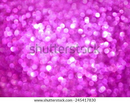 Purple glitter valentine's day background. Purple glitter texture christmas abstract background. Pink background with shimmering  defocused lights.