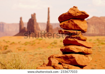 Rocks balanced on each other with view on a hot american national park.