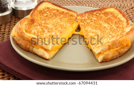 Grilled Cheese Sandwich Served On A Plate
