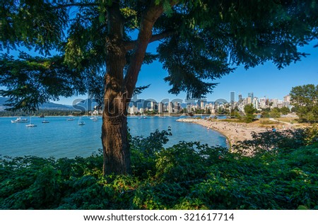 VANCOUVER, BC/CANADA - JULY 30: People enjoying the day at the Kitsilano beach in Vancouver, Canada on July 30, 2015. Kitsilano Beach is one of the most popular beaches in Vancouver.
