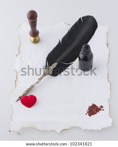 Old paper with pen, wax seal, ink and heart of tissue