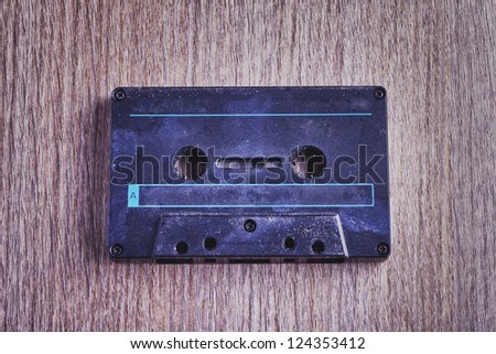 Close up of black old and rugged audio tape