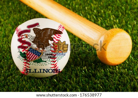 Baseball with Illinois flag and bat over a background of green grass