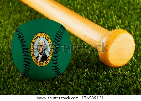 Baseball with Washington state flag and bat over a background of green grass