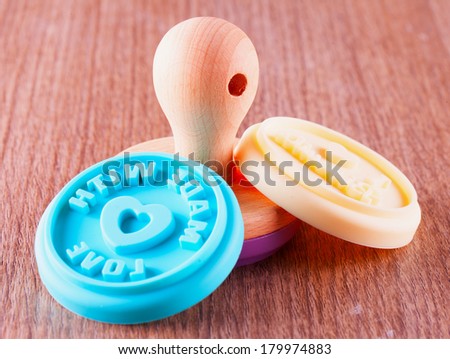 Food stamp with shells of silicone over wooden background