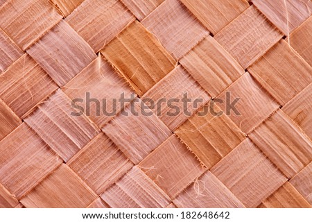 Woven wood background in strict close up