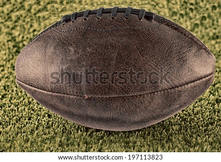 Leather football over a green grass field, hdr image