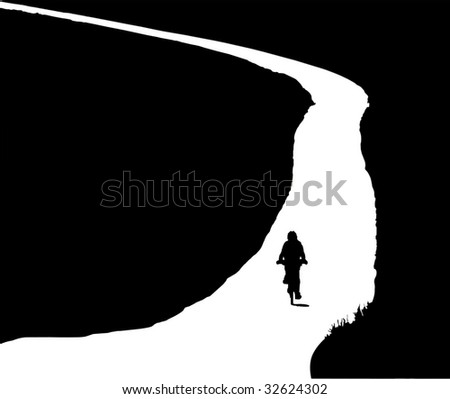 Silhouette of a  woman climbing on bike