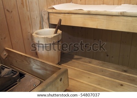 Inside a wooden sauna, with wooden bucket