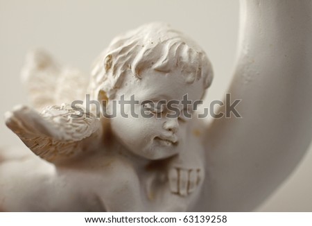 stock photo Closeup of little statue of baby angel sleeping