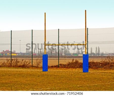 Yellow rugby poles in a rugby field