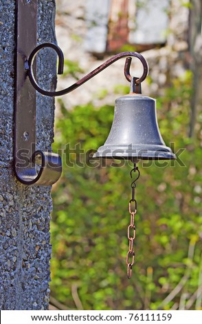 A little old bronze bell with chain