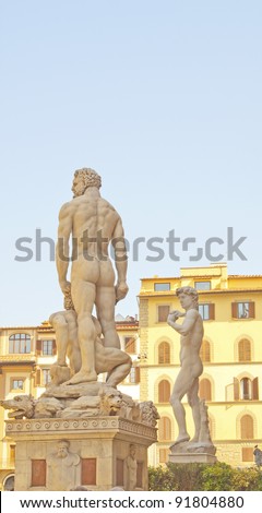 Back view of world famous statue of David of Michelangelo and Hercules and Caco in piazza della Signoria, Florence, Italy