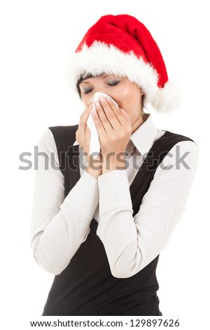 christmas young woman sneezing into tissue, white background