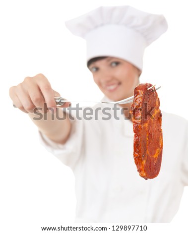 chef woman in white uniform and hat with raw meat, focus on foreground, white background