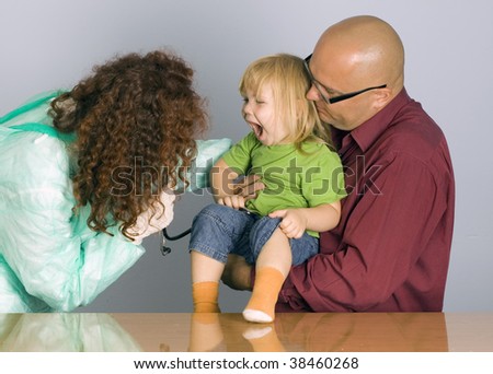 young girl and her father at doctor
