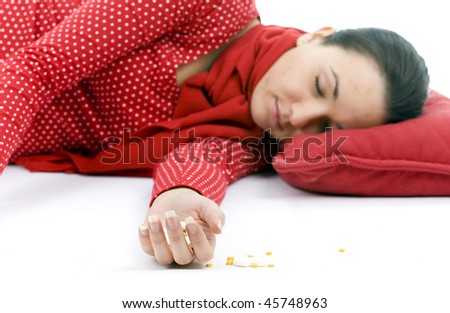 suicide test -  young depressive woman lying on red pillow