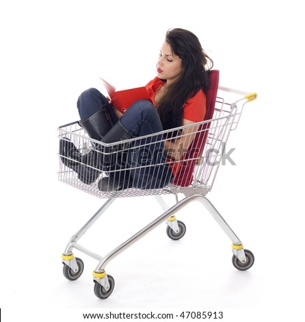 reading book woman sitting in shopping cart