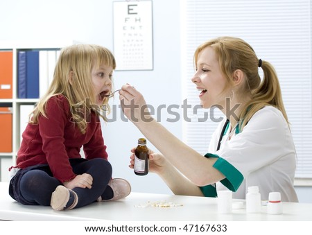 little girl at lady doctor drinks syrup