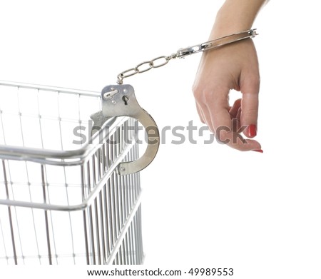 stock photo handcuffed woman hand pinned to shop cart