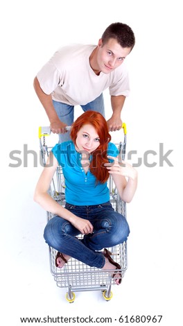 couple - man thrusting shop trolley with woman
