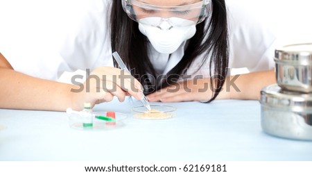 lady doctor or chemist in protective glasses and mask in laboratory; isolated over a white background
