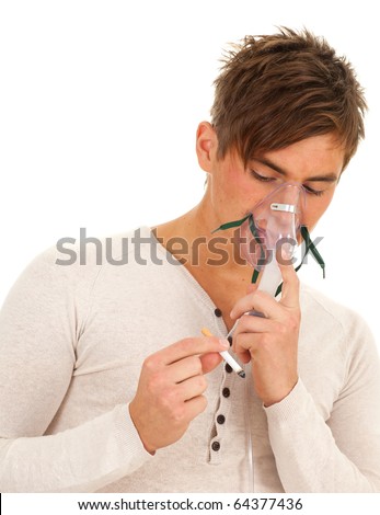 inhalation - young smoking man keeping inhale mask, isolated