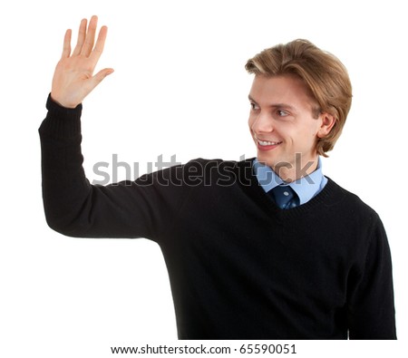 happy, smiling young man with raised arm, waving hello