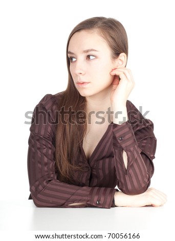 thoughtful young woman in brown blouse look in side