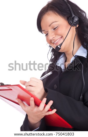 smiling call center young woman with a headset writing on clipboard