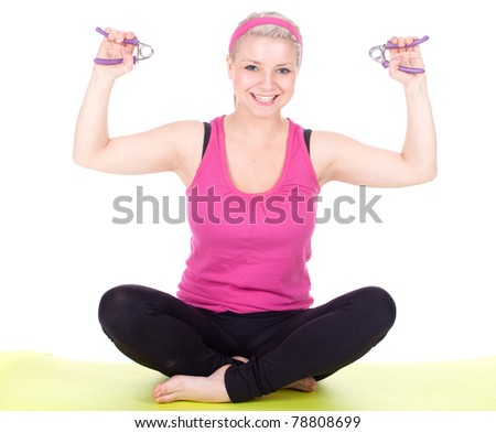 exercising young woman in pink shirt with fitness weights