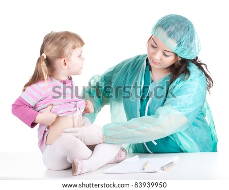 fat woman doctor in green workwear exam small young girl