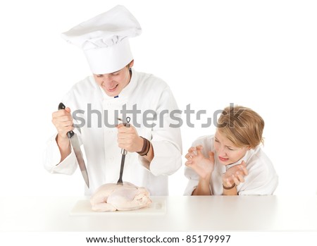 cooks team in white uniforms preparing raw chicken, series